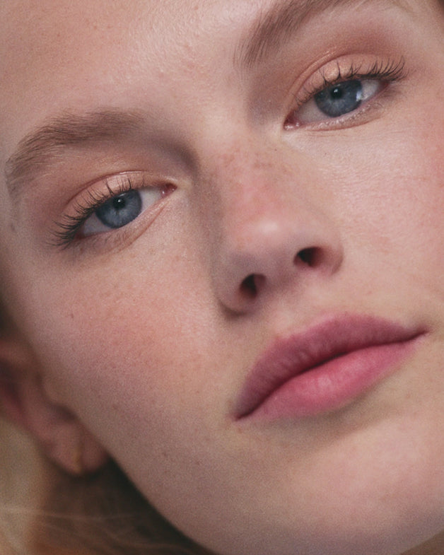 Model applies blonde Brow Pencil and Brow Gel to their brows.