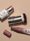 An array of ILIA products including Multi-Stick, Perfecting Buff Brush, and Color Haze.
