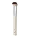A close-up of the Complexion brush with a white handle and soft, dual-toned bristles.