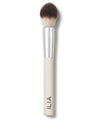 A close-up of the Precision brush with a white handle and dense, dual-toned bristles.