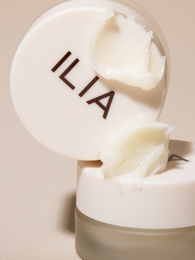 ILIA Lip Wrap Overnight Masks stacked on top of one another with swatches of the formula.