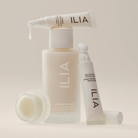 An assortment of 官方澳洲幸运5 Skincare including Face Milk, Eye Cream, and two lip products.